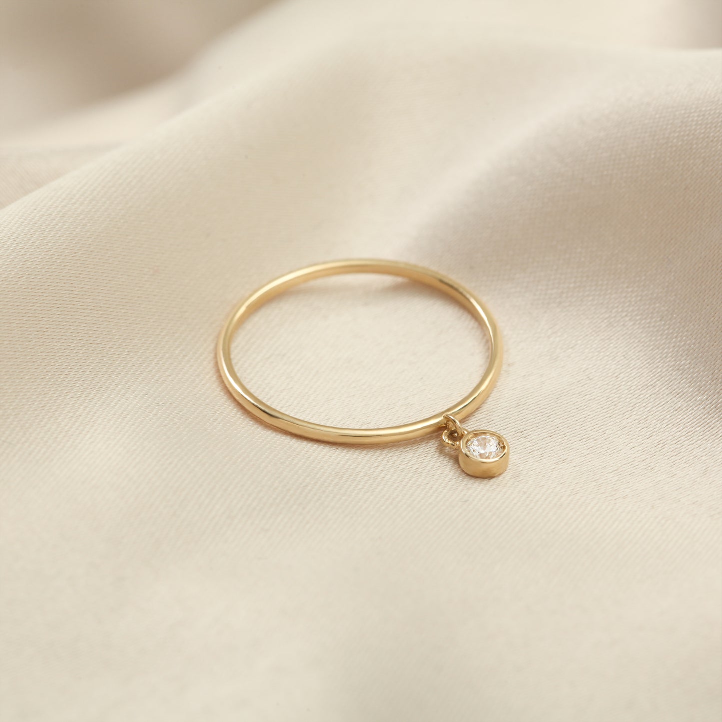 Minimalist 14K Gold Ring with Dangling Zircon