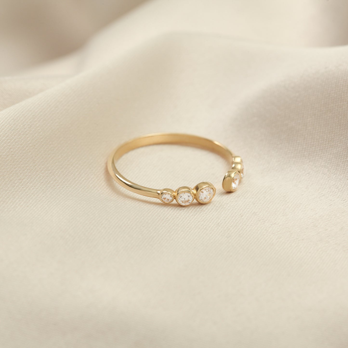 14K Open Gold Ring with Bezel-Set Zircon Stones