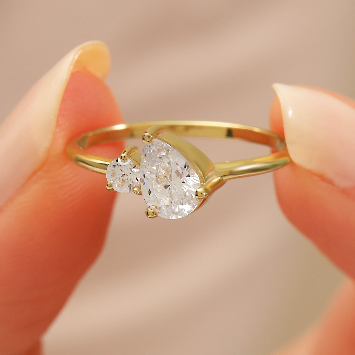 You & Me CZ Ring in 14K Gold – Pear & Round Stones
