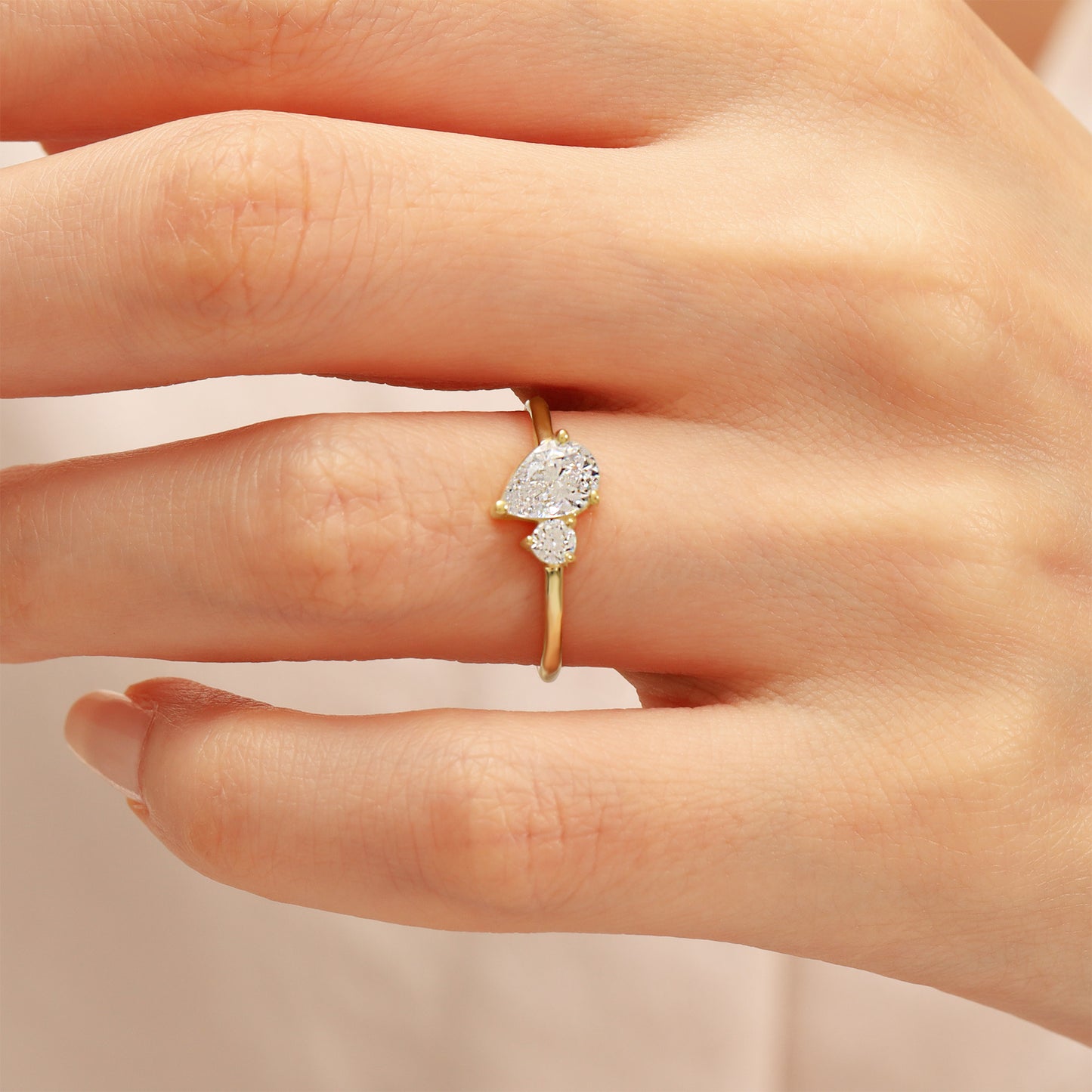You & Me CZ Ring in 14K Gold – Pear & Round Stones