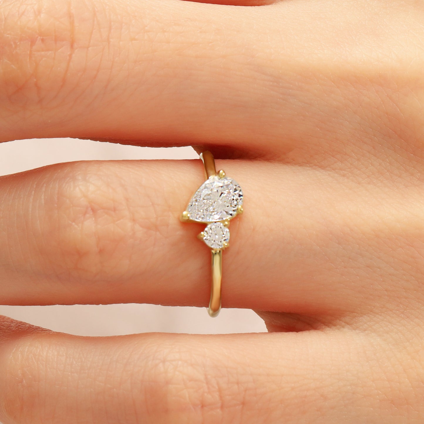 You & Me CZ Ring in 14K Gold – Pear & Round Stones