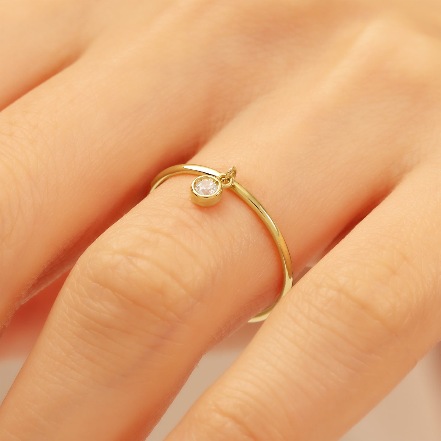 Minimalist 14K Gold Ring with Dangling Zircon