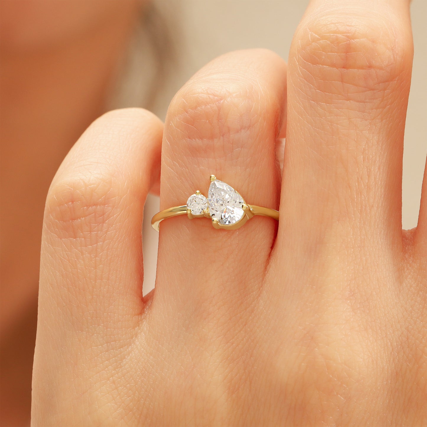 You & Me CZ Ring in 14K Gold – Pear & Round Stones